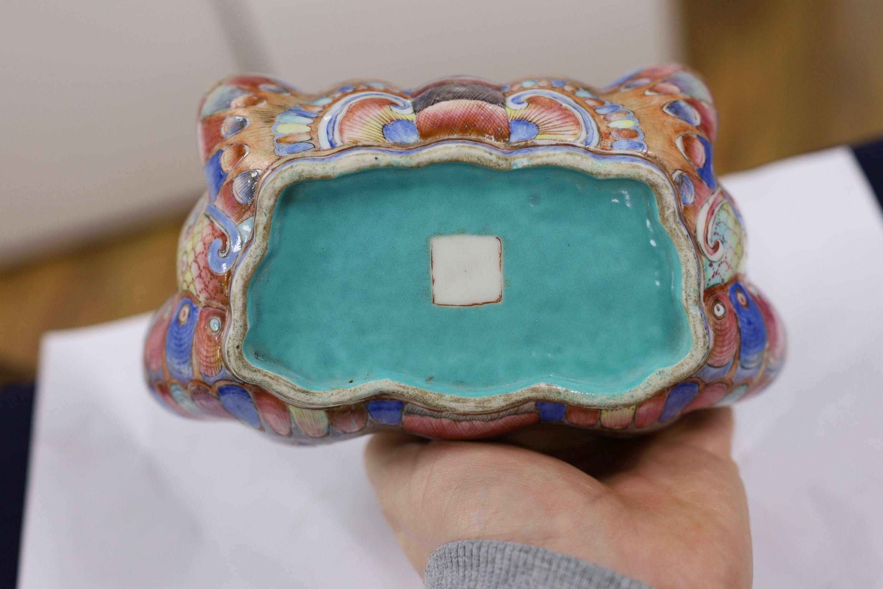 A Chinese enamelled porcelain ‘butterfly’ dish, 19th century, ground off reign mark, 19 cms wide at the front.